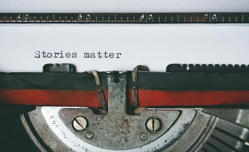 Une Autre Voix - Importance de lhistoire - Une Autre Voix Une machine à écrire avec du texte écrit "Stories matter"